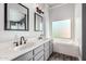 Well-lit bathroom with dual sinks, large mirrors and soaking tub at 1447 E Nighthawk Way, Phoenix, AZ 85048