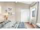 Well-lit bedroom decorated with colorful accents, wood floors, and closet at 1447 E Nighthawk Way, Phoenix, AZ 85048