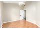 Simple bedroom with wood floors, ceiling fan, closet and neutral walls at 1447 E Nighthawk Way, Phoenix, AZ 85048