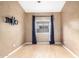 Bright bedroom showcasing neutral textured walls and light wood floors with natural light at 1447 E Nighthawk Way, Phoenix, AZ 85048