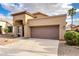 Charming home showcasing a well-manicured lawn, a spacious driveway, and an attached two-car garage at 1447 E Nighthawk Way, Phoenix, AZ 85048