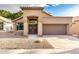 Charming home with tile roof, desert landscaping, and a decorative double door entrance at 1447 E Nighthawk Way, Phoenix, AZ 85048