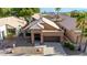 Beautiful home featuring a tile roof, desert landscaping, and an attached two car garage at 1447 E Nighthawk Way, Phoenix, AZ 85048