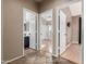 Open hallway featuring entrances to the bathroom and bedroom areas showcasing the home's layout at 1447 E Nighthawk Way, Phoenix, AZ 85048