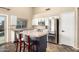 Kitchen features a tiled island with seating, stainless appliances, and white cabinetry at 1447 E Nighthawk Way, Phoenix, AZ 85048