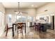 Eat-in kitchen area features a dining table, granite counters and stainless appliances at 1447 E Nighthawk Way, Phoenix, AZ 85048