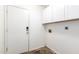 Clean laundry room featuring white walls, neutral flooring, and essential utility hookups at 1447 E Nighthawk Way, Phoenix, AZ 85048