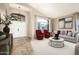 Open-concept living room staged with modern furniture, offering a comfortable and stylish space at 1447 E Nighthawk Way, Phoenix, AZ 85048