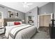 Luxurious main bedroom featuring plush bedding, artwork and ensuite bathroom at 1447 E Nighthawk Way, Phoenix, AZ 85048