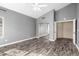 Spacious main bedroom with wood floors, ceiling fan, and closet at 1447 E Nighthawk Way, Phoenix, AZ 85048