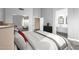 Stylishly furnished main bedroom featuring a large bed and ensuite bathroom at 1447 E Nighthawk Way, Phoenix, AZ 85048