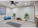 Basement with carpeting, ceiling fan and room for exercise equipment at 1457 W Bahia Ct, Gilbert, AZ 85233