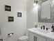 Charming powder room with white vanity and quirky decor for a playful vibe at 1457 W Bahia Ct, Gilbert, AZ 85233