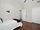Bedroom with vaulted ceiling, ceiling fan, and two large closets at 1457 W Bahia Ct, Gilbert, AZ 85233