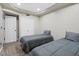 Bedroom featuring two twin beds, carpet, and a closet with sliding doors at 1457 W Bahia Ct, Gilbert, AZ 85233