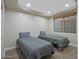Bedroom featuring two twin beds, a window well, and recessed lighting at 1457 W Bahia Ct, Gilbert, AZ 85233
