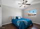 Bright bedroom features a vaulted ceiling, ceiling fan, and large window view to outdoors at 1457 W Bahia Ct, Gilbert, AZ 85233