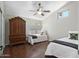 bedroom features a vaulted ceiling, ceiling fan, and views to the outdoors at 1457 W Bahia Ct, Gilbert, AZ 85233