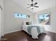Bright bedroom features a vaulted ceiling, ceiling fan, and windows with views to the outdoors at 1457 W Bahia Ct, Gilbert, AZ 85233