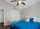 Bedroom features a vaulted ceiling, ceiling fan, and closet with sliding doors at 1457 W Bahia Ct, Gilbert, AZ 85233