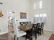 Dining room featuring a wooden table, seating for eight, and lots of natural light at 1457 W Bahia Ct, Gilbert, AZ 85233