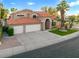 View of a two-story home with a three-car garage, tile roof, desert landscaping, and well-manicured lawn at 1457 W Bahia Ct, Gilbert, AZ 85233
