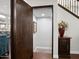 Hallway with dark wood bookcase, staircase with wood railing, small beverage center at 1457 W Bahia Ct, Gilbert, AZ 85233