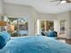 Bright main bedroom with pool views and cozy seating area at 1457 W Bahia Ct, Gilbert, AZ 85233