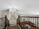 Staircase leading to living room featuring hardwood steps, iron railings, and decorative accents at 1457 W Bahia Ct, Gilbert, AZ 85233