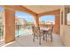 Relax on this inviting balcony with patio seating and views of the pool and courtyard at 14575 W Mountain View Blvd # 11315, Surprise, AZ 85374