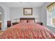 A spacious bedroom with neutral walls, a ceiling fan and a window for natural light at 14575 W Mountain View Blvd # 11315, Surprise, AZ 85374