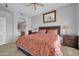 A spacious bedroom with neutral walls, a ceiling fan and a window for natural light at 14575 W Mountain View Blvd # 11315, Surprise, AZ 85374