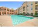 Enjoy community living with a sparkling pool and ample seating for relaxation and socializing at 14575 W Mountain View Blvd # 11315, Surprise, AZ 85374