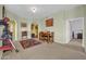Cozy dining room with neutral walls, wooden dining set, and a view into adjacent rooms at 14575 W Mountain View Blvd # 11315, Surprise, AZ 85374