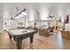 Entertaining game room with a pool table, ample seating, and a partial kitchen area, perfect for socializing at 14575 W Mountain View Blvd # 11315, Surprise, AZ 85374