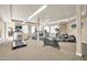 Well-lit gym equipped with treadmills, ellipticals, and other exercise machines, promoting an active lifestyle at 14575 W Mountain View Blvd # 11315, Surprise, AZ 85374
