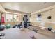 Well-equipped gym with various exercise machines, free weights, and a wall-mounted TV at 14575 W Mountain View Blvd # 11315, Surprise, AZ 85374