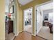 Hallway with tile flooring, doors to office and bedroom at 14575 W Mountain View Blvd # 11315, Surprise, AZ 85374