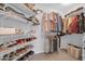 Walk-in closet with extensive shelving and hanging space for organized storage at 14575 W Mountain View Blvd # 11315, Surprise, AZ 85374
