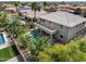The backyard of this home features a private pool, covered patio and mature landscaping at 15138 W Campbell Ave, Goodyear, AZ 85395