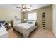 This comfortable bedroom has a double bed, a window, and a small stuffed animal at 15138 W Campbell Ave, Goodyear, AZ 85395