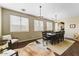 Bright dining room featuring hardwood floors, large windows, and stylish lighting at 15138 W Campbell Ave, Goodyear, AZ 85395