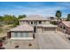 A spacious house with a well-manicured lawn, three-car garage, and a tile roof exudes sophistication at 15138 W Campbell Ave, Goodyear, AZ 85395