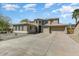 Lovely two-story home with desert landscaping, two-car garage, and barrel tile roof at 15138 W Campbell Ave, Goodyear, AZ 85395