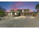 Stunning two-story home with a three-car garage and desert landscaping at 15138 W Campbell Ave, Goodyear, AZ 85395