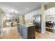 Open kitchen with white cabinets, granite countertops, an island, and stainless steel appliances at 15138 W Campbell Ave, Goodyear, AZ 85395