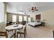 Spacious main bedroom featuring a sitting area, ceiling fans and neutral decor at 15138 W Campbell Ave, Goodyear, AZ 85395