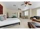 Large main bedroom with a seating area, a ceiling fan, and a comfortable layout at 15138 W Campbell Ave, Goodyear, AZ 85395