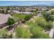 Picturesque neighborhood view shows mature trees and well-maintained homes under a vast sky at 15138 W Campbell Ave, Goodyear, AZ 85395