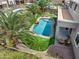 Aerial view of a sparkling pool surrounded by lush, green grass creates a backyard oasis at 15138 W Campbell Ave, Goodyear, AZ 85395